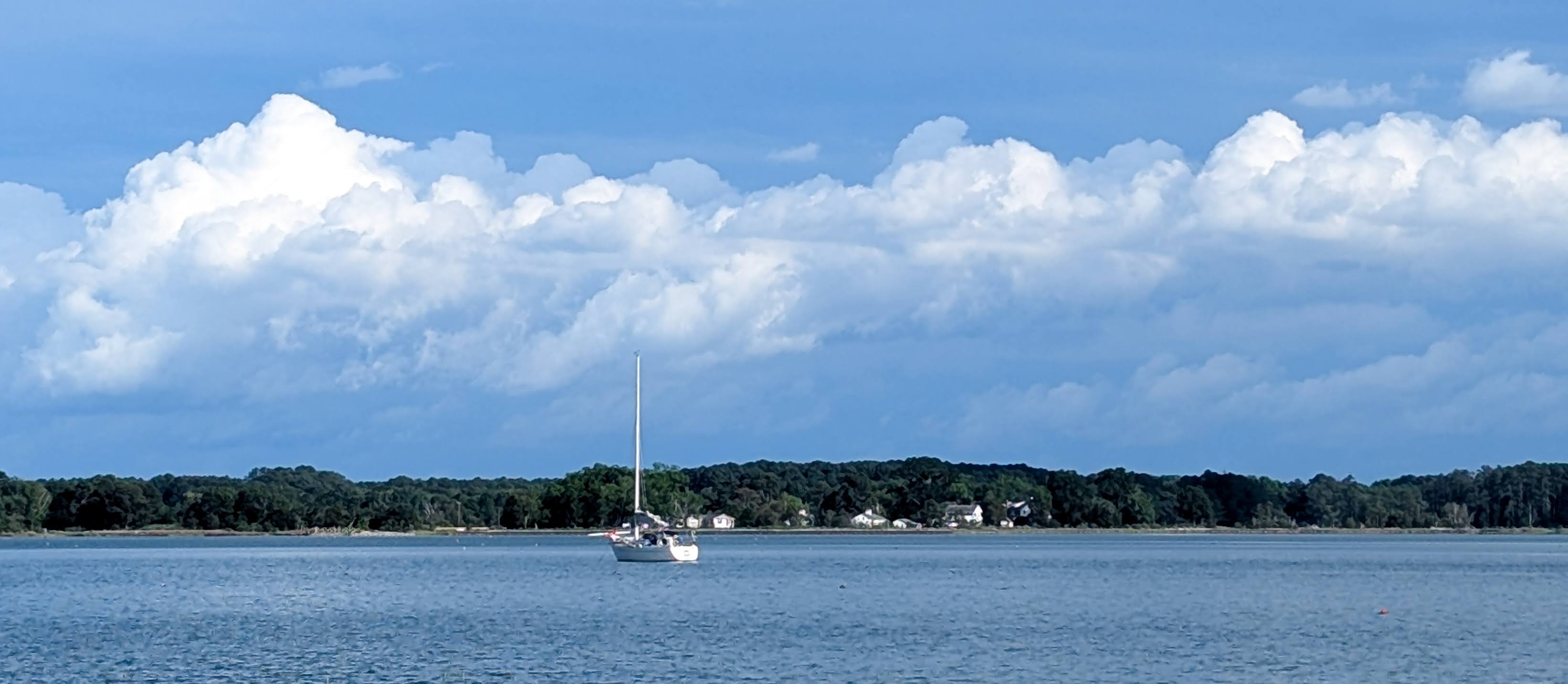 SV Aion sailing under clear skies